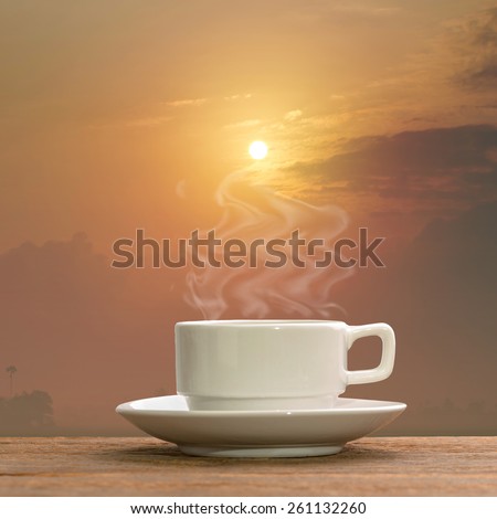 Morning Hot coffee with sunrise background.