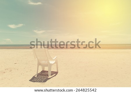 White sun chair on beach of Thailand. Vintage filter.