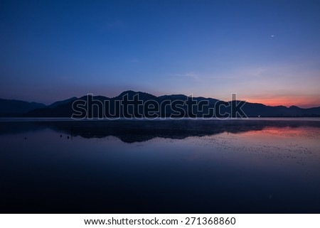 Beautiful serene lake and mountain  with morning twilight sky.