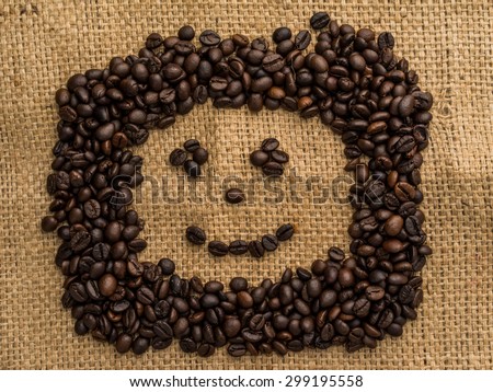 Coffee bean on sackcloth made smile face.