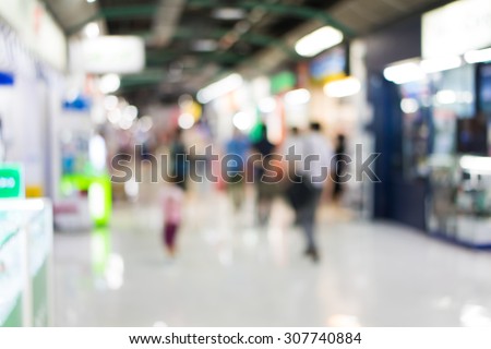 Blur of people shopping in supermarket.