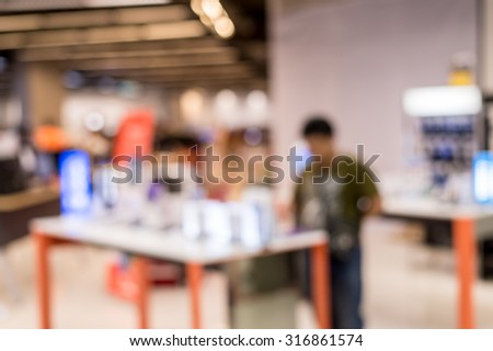 Abstract blurred people shopping in super centre.
