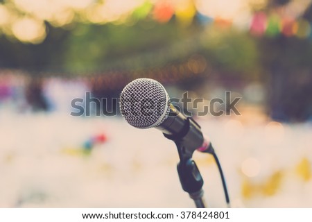 Retro microphone for outdoor concert party. Vintage filter.