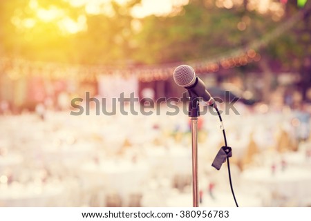Retro microphone for outdoor concert party. Vintage filter.