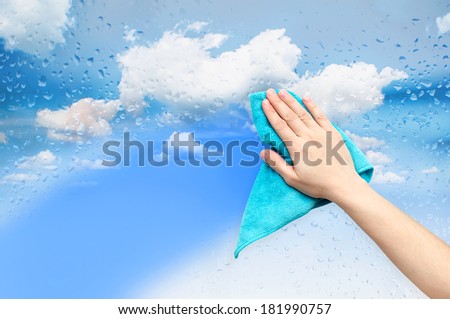 Hand washing window with a blue cloth.