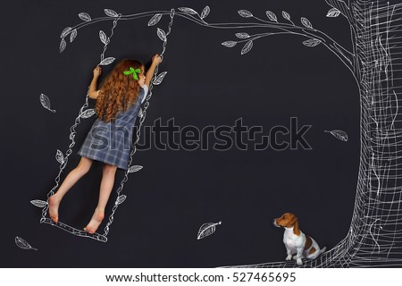 Spring curly girl on a swing. Hand drawing tree on a blackboard. Happy childhood concept.