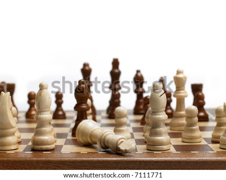 Black bishop beats the white king in a chess game.