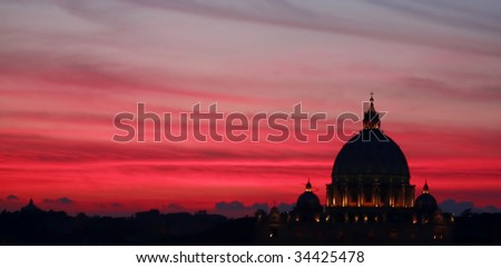 Rome, Italy, black silhouette of Vatican Basilica at dusk on red magenta sky. Panoramic shot.