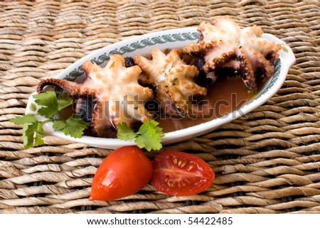 Food and Drinks - Italian recipes - Plate with octopus cooked in italian style.