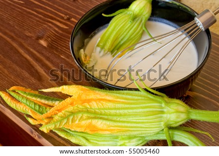 Food And Drinks - Italian Food - Closeup of bowl with batter and zucchini flowers.