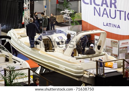 ROME, ITALY-FEBRUARY 19: Big Blue Rome Sea Expo-Boat Show -  In this picture the Cicar Nautica stand with visitors exploring the  luxury E-MOTION 29 dinghy-February 19, 2011 in Rome.