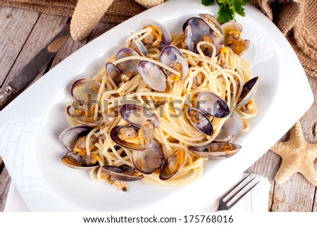 Plate of spaghetti with clams, typical recipe of the Mediterranean cuisine.