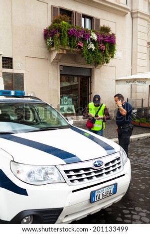 ROME, ITALY - JUNE 18, 2014: Officers of municipal police at work in Piazza Navona.