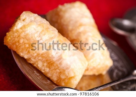 Finger baklava is a traditional ottoman dessert made by  tightly rolled fillo dough stuffed with ground cashew.
