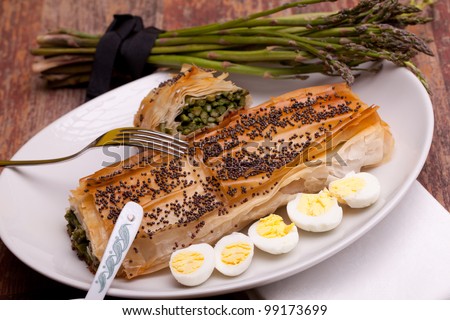 Mediterranean cuisine recipes - Asparagus in crust with poppy seeds on top and quail eggs.