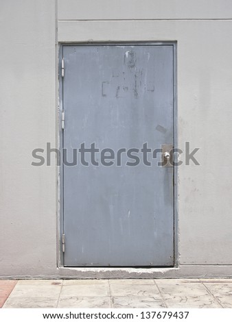 exterior side of gray door in daytime