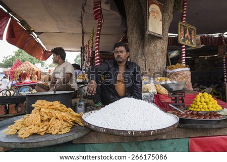 PUSHKAR INDIA-OCT 29 :  monger and sweet stall in Pushkar city, basiclly indian sweet in sweet stall is jelebis and gulab jamun on october,29, 2014, india
