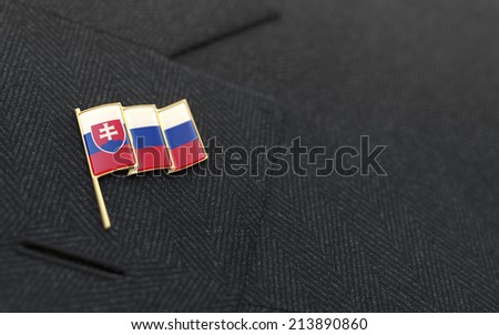 Slovakia flag lapel pin on the collar of a business suit jacket shows patriotism