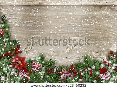 Grunge wood background with Christmas fir tree, holly&mittens