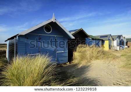 Beach huts in sand dunes at Mudeford Spit on Hengistbury Head near Christchurch in Dorset.