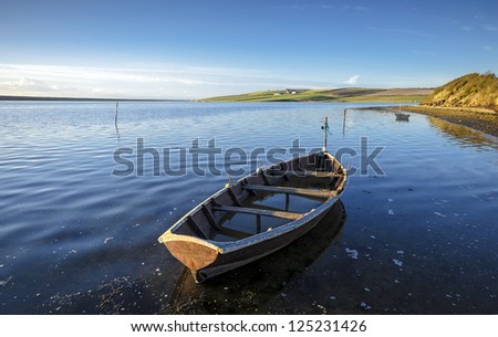 Boats at the Fleet lagoon near Weymouth in Dorset