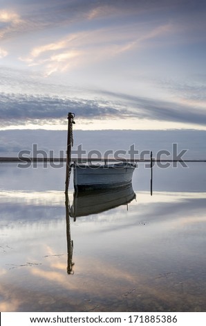 Boat on the Fleet Lagoon at Chesil Beach near Weymouth in Dorset