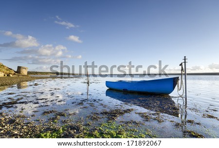 Blue boat on the Fleet Lagoon near Weymouth in Dorset