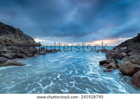 Stormy sunrise at Penberth Cove in the far west of Cornwall