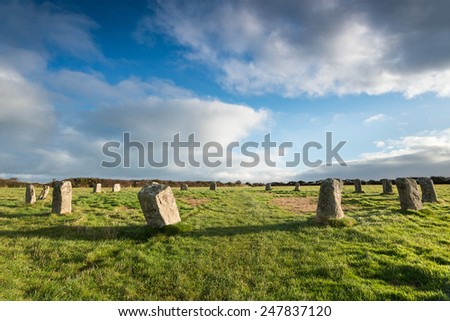 Blue sky over the Merry Maidens a neolithic stone circle near St Buryan in the far west of Cornwall - also known as the Dawn\'s Men.