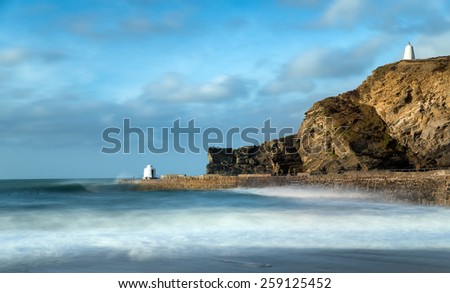 A long exposure of the harbour at Portreath in Cornwall, the white building on the pier is known as the Monkey Hut and the one on the cliffs as the Pepper Pot