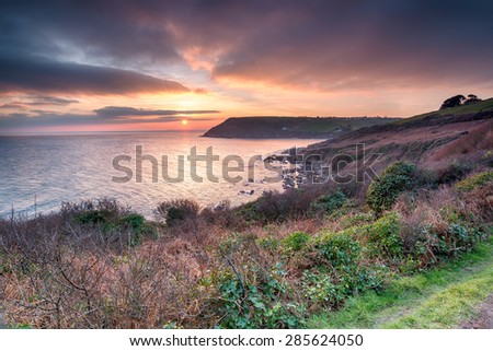 Stunning sunset from the South West Coast Path at Talland Bay on the south coast of Cornwall