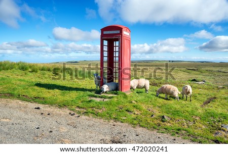 Sheep in a red telephone box on the Isle of Skye in Scotland