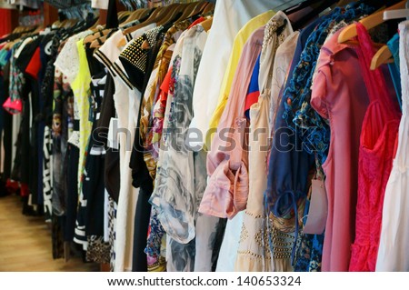 Colorful Women\'S Dresses On Hangers In A Retail Shop