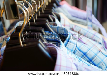 Mens Plaid Shirts On Hangers In A Retail Store