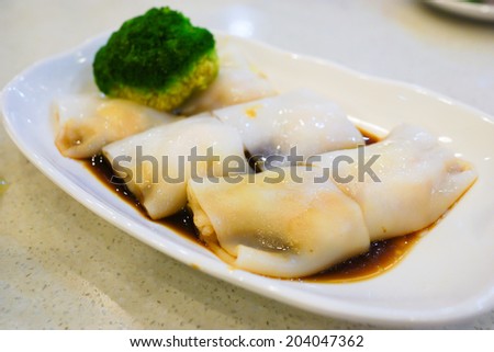 Rice noodles rolls on a plate at Hong Kong dim sum restaurant