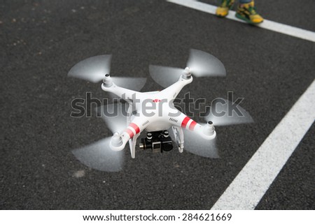 SHANGHAI,CHINA-April 30,2015:Flying drone quadcopter Dji Phantom 2 with digital camera GoPro HERO4.