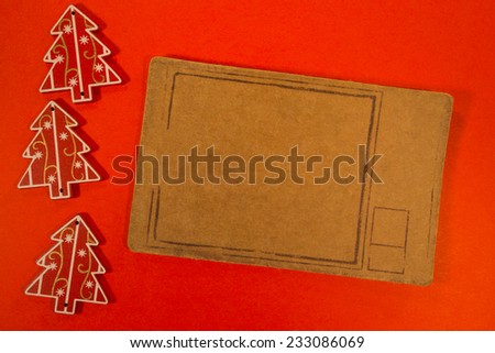 Empty tag with Christmas decorations on red background. Three Christmas decoration with pricetag
