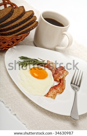 fried egg with coffee and bread close up