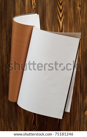 Magazine's page on wooden background