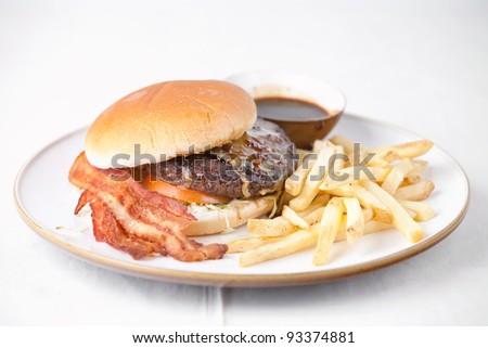 Lunch time with big Burger and french fries on white background