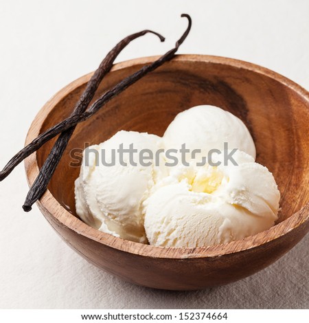 Vanilla ice cream in wooden bowl
