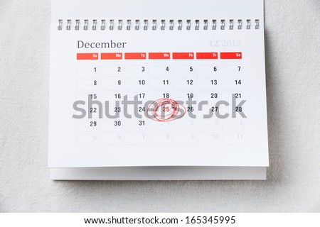 Calendar with 25 December Christmas date with red circle shape marker