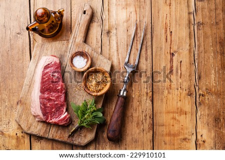 Raw fresh meat of South American premium beef New York steak Striploin on wooden background