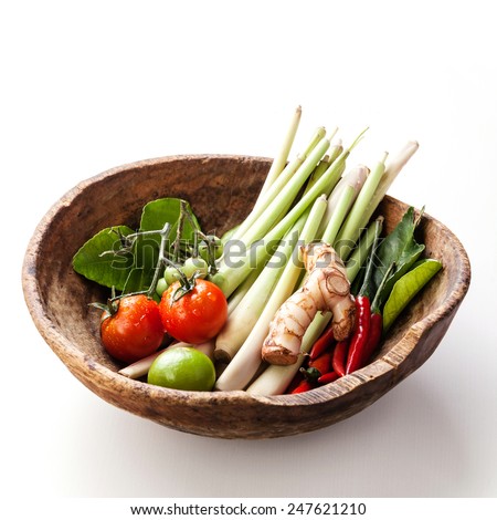 Ingredients for spicy Thai soup Tom Yam with chili pepper and lemon grass on white wooden background