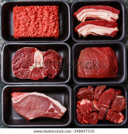 Different types of meat in plastic boxes packaging tray