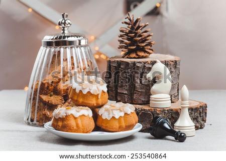 objects on sackcloth bank and cookies with nuts and cupcake and chess