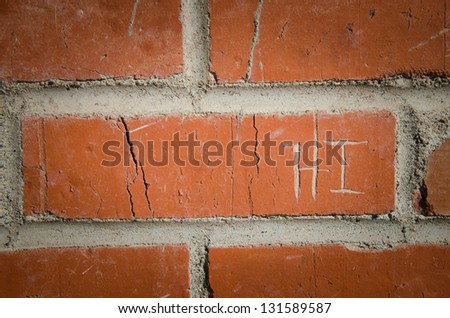 Etched red bricks with greeting.