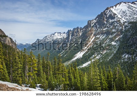 The North Cascade Mountains. Highway 20 in Washington state travels over Washington Pass and Rainy Pass through deep valleys and gorgeous mountain peaks. Also called the North Cascades Highway.