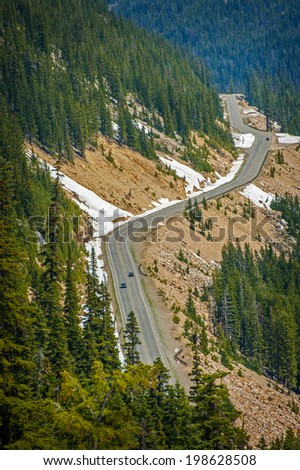North Cascades Highway. The North Cascades Highway, also known as Highway 20, travels along a stretch called Rainy Pass through evergreen forests and dramatic mountain peaks.