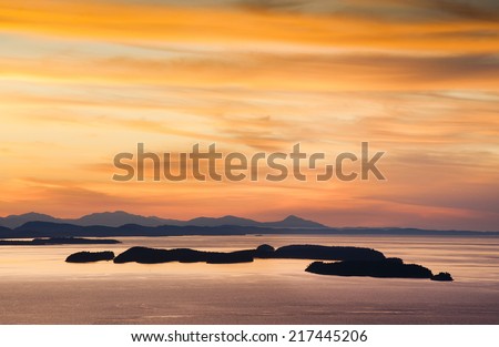 The San Juan Islands. Sunset over the San Juan Islands of Puget Sound in western Washington State, USA. Orcas Island, Clark and Barnes Island with Matia and Sucia in Canadian waters in the background.